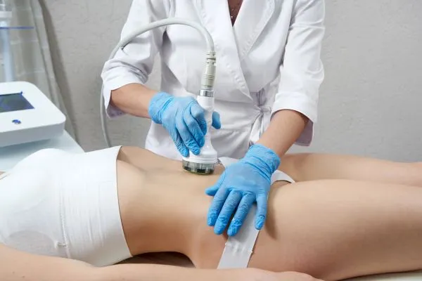 Lost the Weight but Not the Loose Skin? 2 woman having HIFU treatment on her stomach to combat loose skin Anstey following weight loss